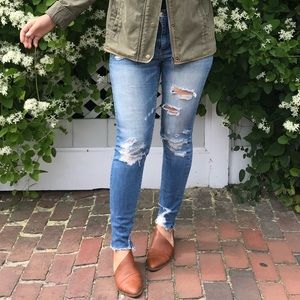 Medium wash high rise distressed skinny jeans